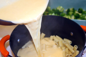 Add the cheese sauce to the pasta.